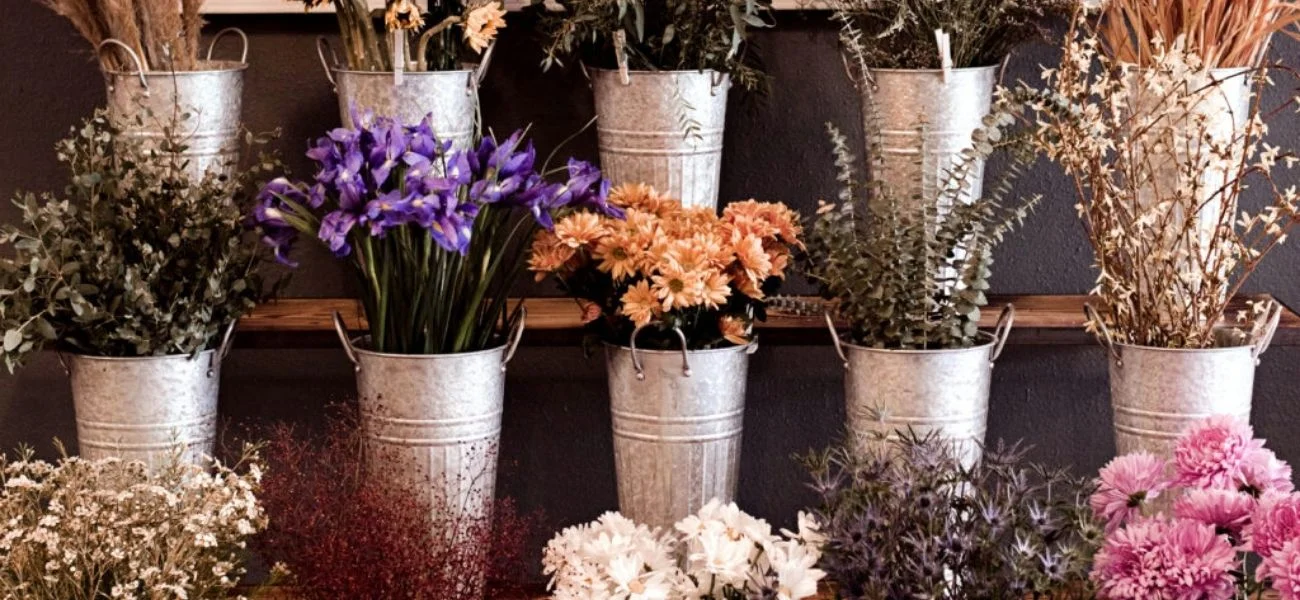 Buckets of fresh stems at Sweetwater's flower bar